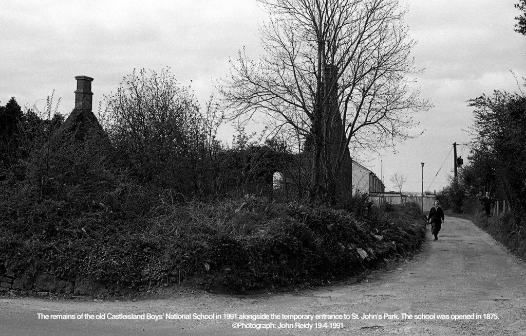 The remains of the old Castleisland Boys’ National School in 1991 alongside the temporary entrance to St. John’s Park. The school was opened in 1875. ©Photograph: John Reidy 19-4-1991